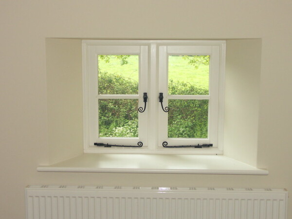 casement windows with monkey tail