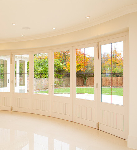 Timber Bi-Fold Doors: Natural Light and Open Space