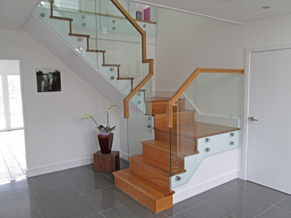 Modern home hallway with U shaped staircase