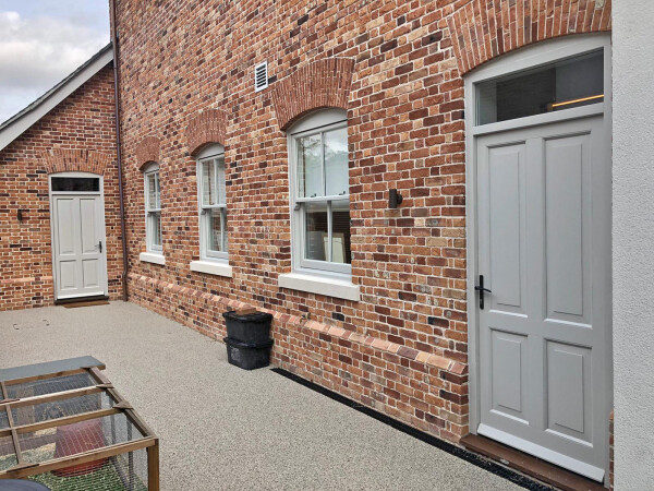 light grey paint finishes on a timber door and sash windows