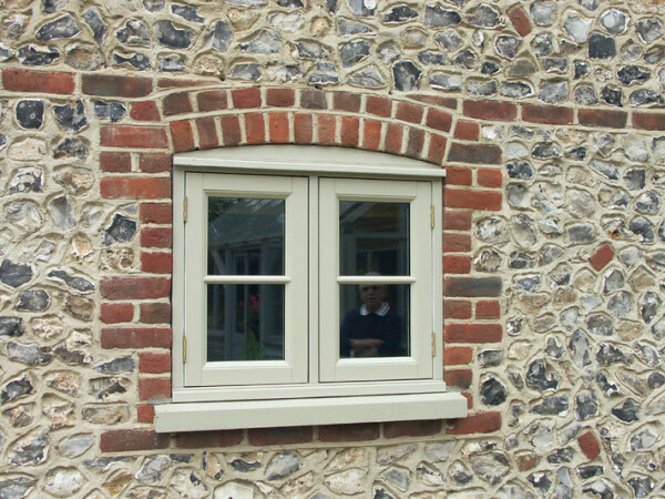 small casement window in a stone wall