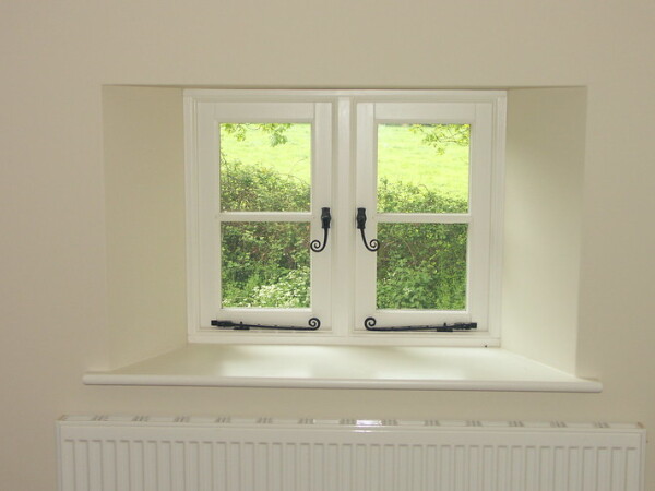 casement windows with monkey tail