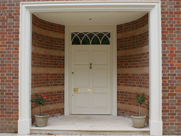 large white traditional timber front door