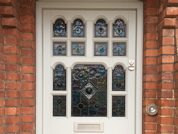close up of a glass mosaic front door